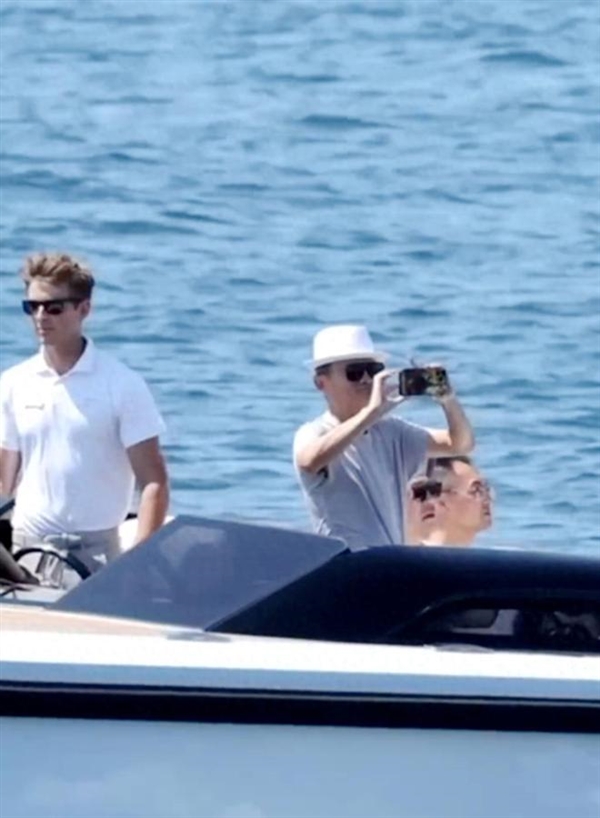 Jack Ma spotted on a luxurious yacht in France, exuding a cool vibe with a white straw hat.